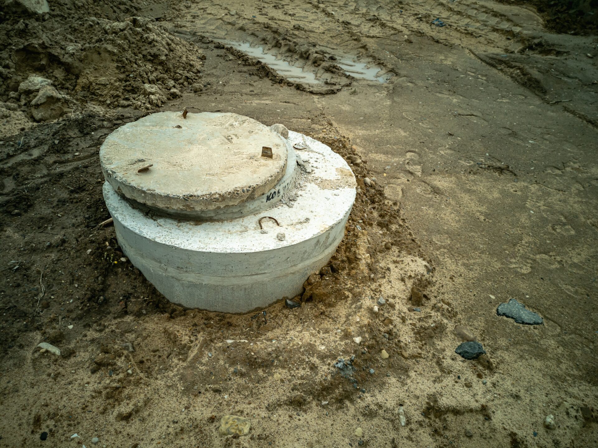 Dug In Concrete Well Rings With A Concrete Cover. Plumbing And Sewerage.